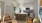 a living room and a kitchen with a table and chairs