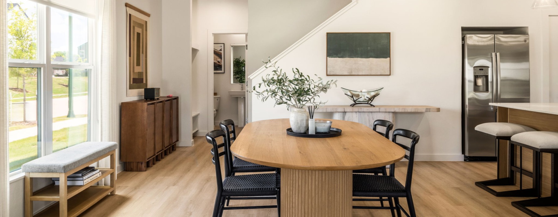 a dining room and bar stools in a rental townhome in Fort Worth