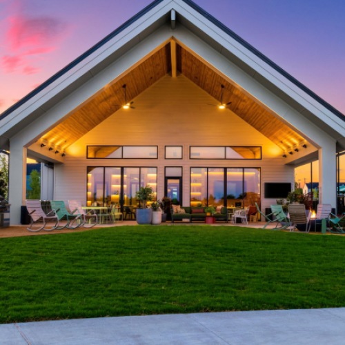 large amenity lawn and grills in front of a community clubhouse