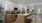 a kitchen with a island and chairs