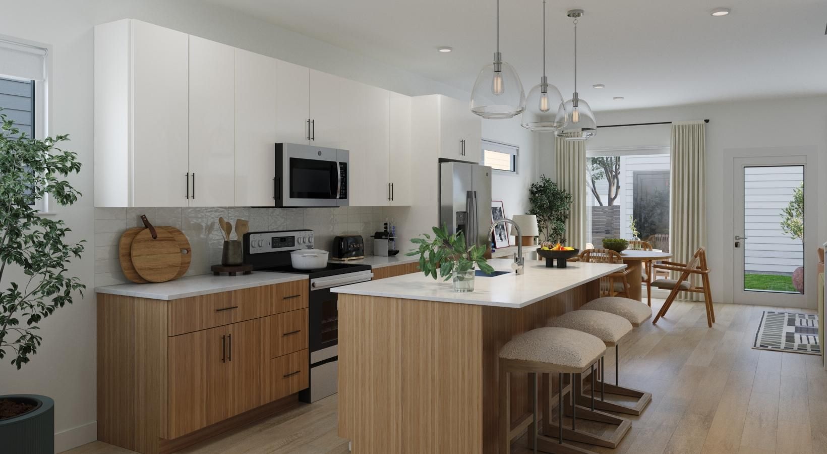 Spacious kitchens with thoughtful details a kitchen with a island and chairs