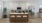 a kitchen with a bar stool and a refrigerator