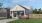 a rendered house with a lawn