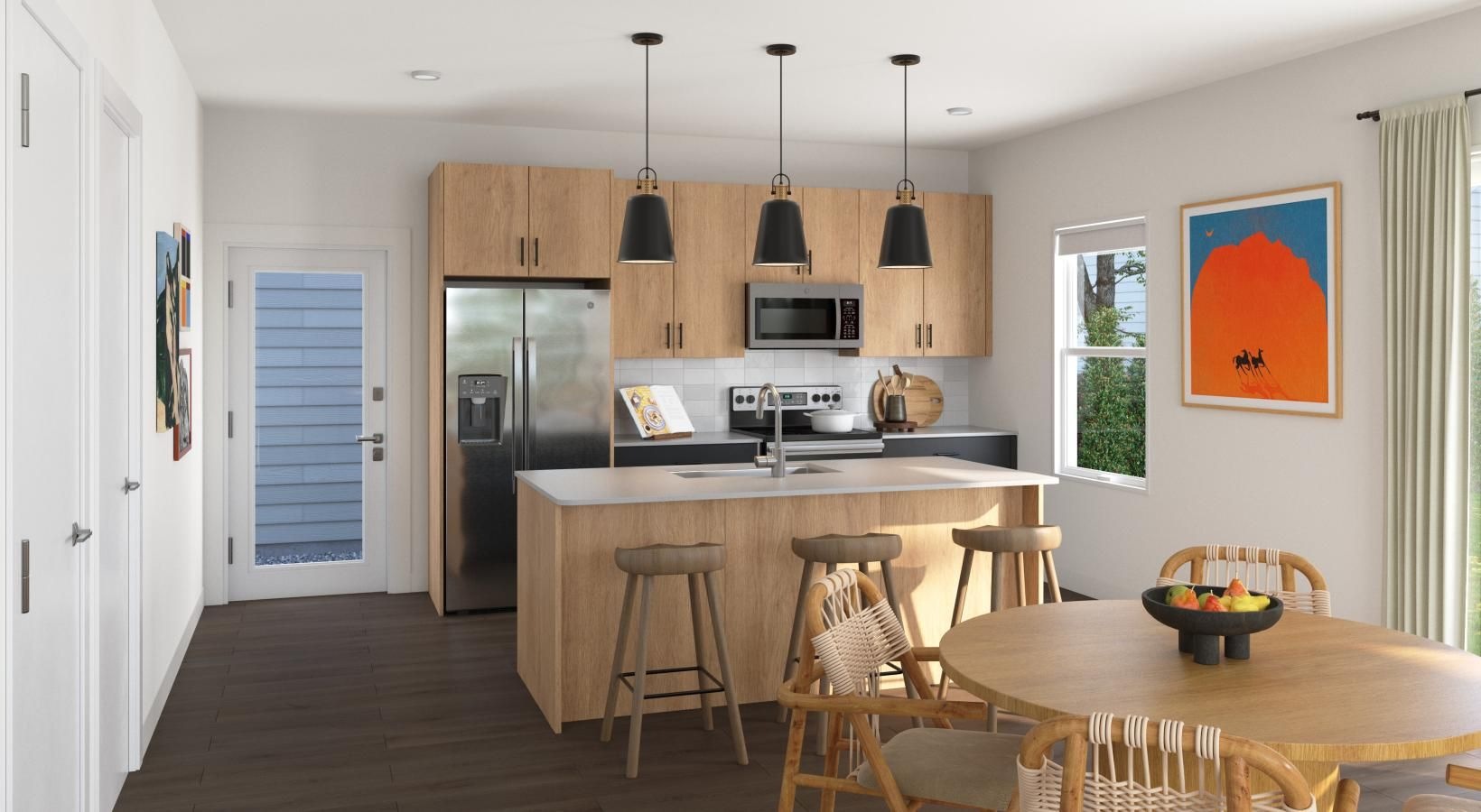 Spacious kitchens with thoughtful details a kitchen with a dining table and a refrigerator