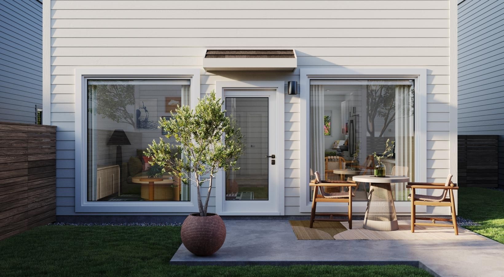 Gorgeous natural light in your living space a house with a large window and patio area