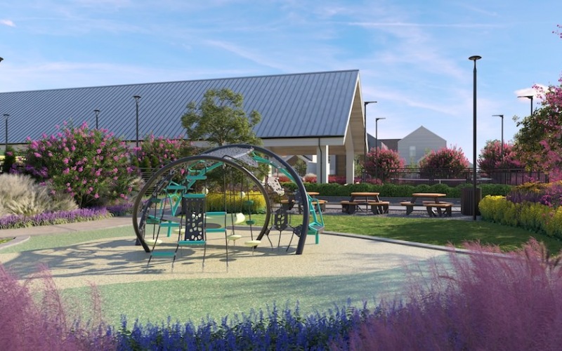 Pocket parks and outdoor spaces designed for all to enjoy. playground and picnic tables at a park