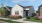 a house with a driveway and a large front yard