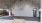 a bench sits in front of a basketball court