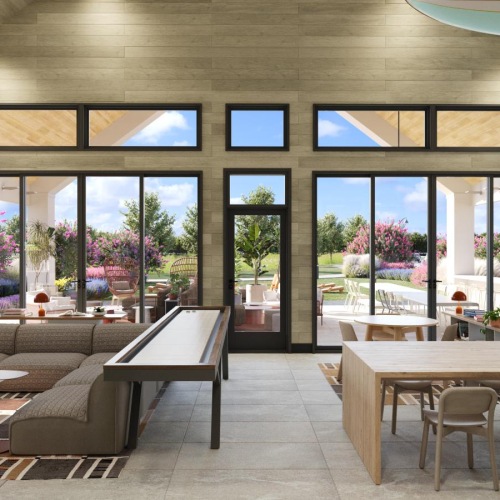 a clubhouse room with a table and chairs