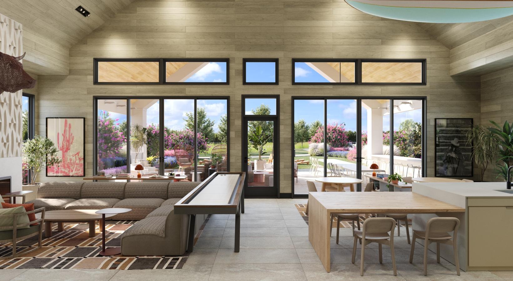 Cutting-edge amenities at your fingertips a clubhouse room with a table and chairs